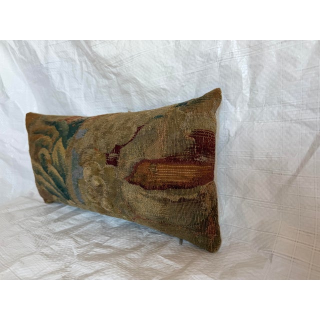 This antique pillow is fashioned from an authentic 17th-century Brussels tapestry textile, preserving a fragment of the...