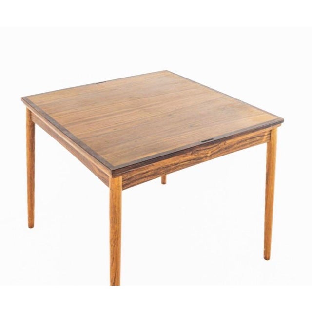Poul Hundevad Mid Century Rosewood Expanding Game Table The table measures: 35.25 wide x 35.25 deep x 27 high, with a...