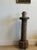 A striking antique French wine press screw repurposed as a sculptural pedestal, with its deeply carved helical shaft...
