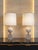 A striking and highly refined pair of travertine table lamps designed by philippe barbier for maison barbier, embodying...