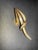 Capturing the sleek, sculptural spirit of Mid-Century Modern design, this vintage Trifari brooch features a soaring,...