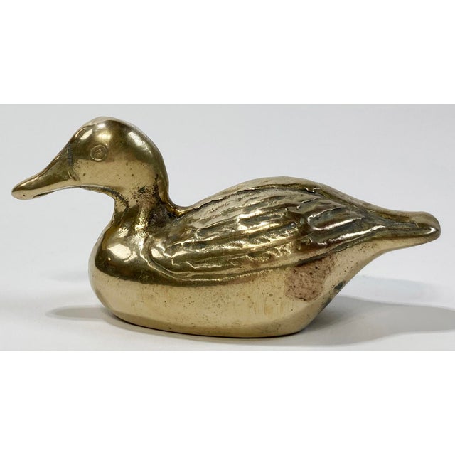 Vintage brass duck figure with detailed wings. For use as paper weight or decorative object. Heavy, solid brass. Patina.