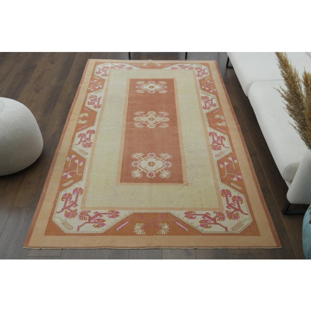 Vintage Turkish Hand-Knotted vintage rug is a semi-antique vintage area rug.'70s Eastern region of Turkey's unique rug is...