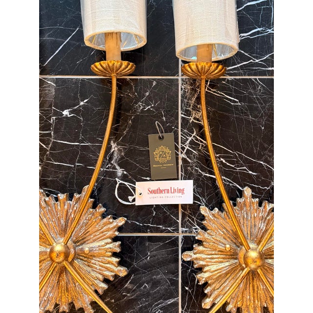 New pair of elegant gilded double-arm “Louis sconces” by Regina Andrews, joined by starbursts and accented perfectly with...