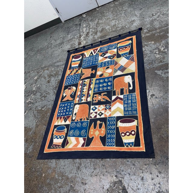 Design Plus Gallery presents a Hand Painted African Batik Wall Hanging from South Africa. The textile offers you vibrant...