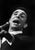 This photo shows the French singer Gilbert Bécaud during a concert in East Berlin in 1964. In the image, Bécaud is...