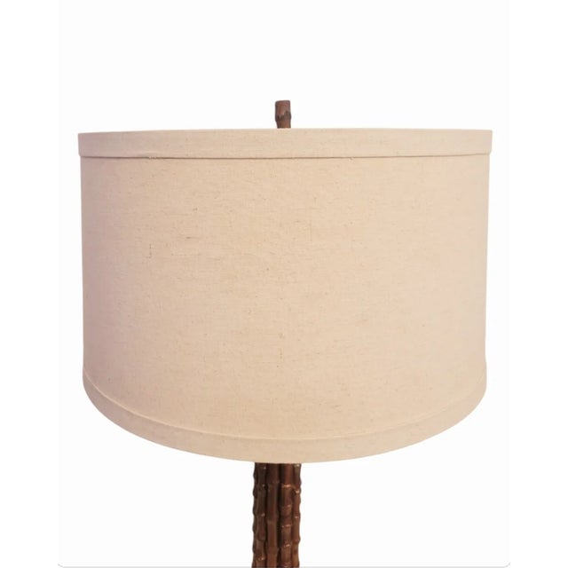 A beautiful painted real bamboo table lamp. The lamp was given a pretty coppery, bronze finish and topped with a creamy...