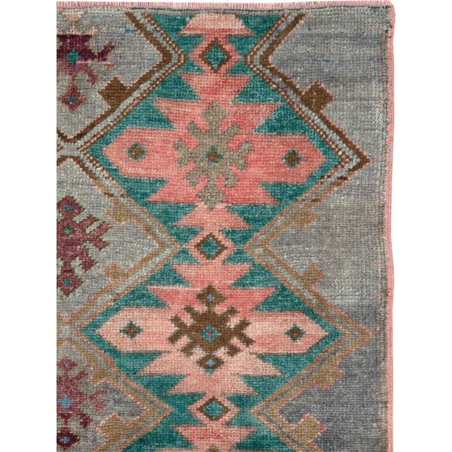 A vintage Turkish Anatolian small throw rug handmade during the mid-20th century. Measures: 3' 5" x 4' 11".