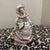 A vintage porcelain figurine of a Victorian lady, produced by the Shafford brand in Japan around the 1950s.