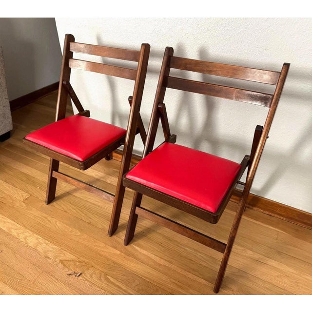 A striking pair of mid-century folding chairs by Nevco Furniture Corp., Yonkers, New York (circa 1950s–60s). Each chair...