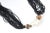 Vintage 18-strand black glass bead necklace featuring a large geometric bead with mother-of-pearl sections between two...