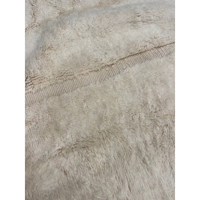 This exceptional Moroccan Beni M'rirt rug is a contemporary handcrafted piece woven by skilled artisans in the Middle...