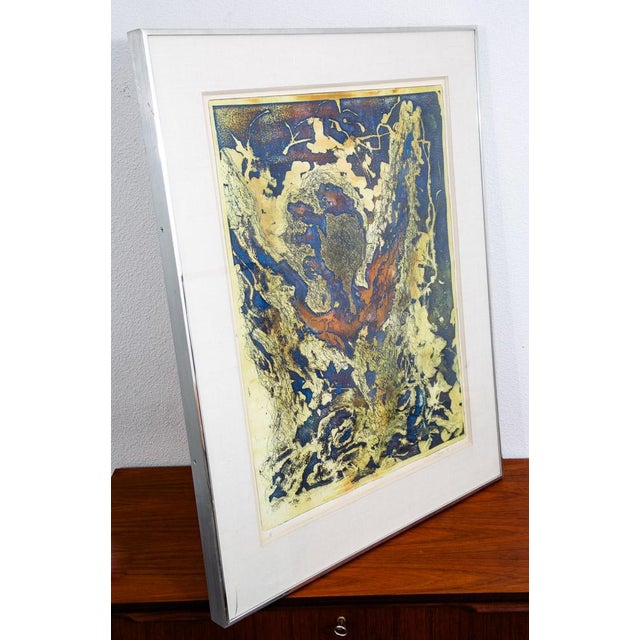Abstract Mid century modern artist proof print. The piece offers yellow, orange and blue throughout. the subject of the...