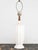 This elegant 1960s-era vintage table lamp features a fluted white ceramic body with a gently tapered shape, widening...