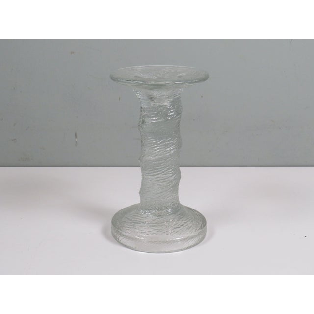Sculptural ice-glass candle holder produced in Finland circa 1965–75. The organic, frozen-water texture and strong...