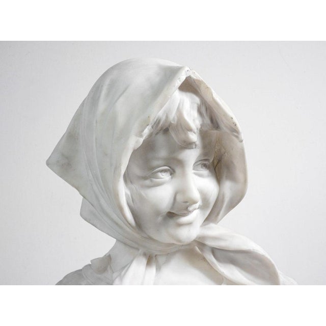 Marble bust of a shepherdess with a water bottle slung over her shoulder. Origin italy period nineteenth century author...