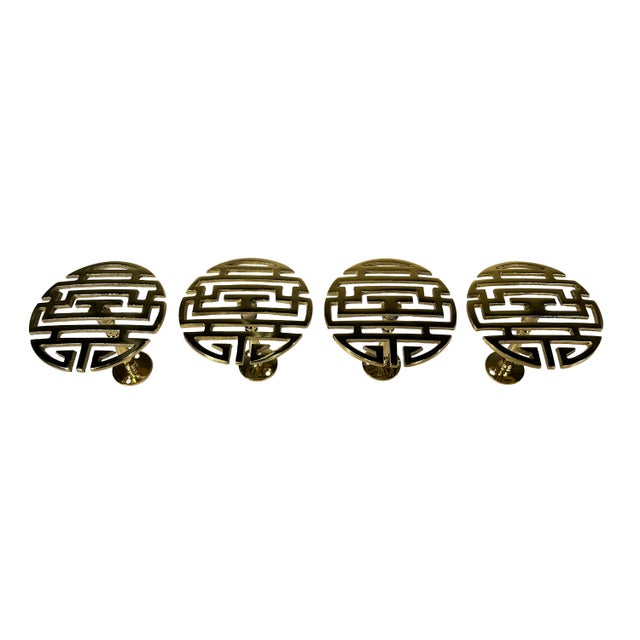 Two sets (total of four) vintage polished brass Chinese Shou character for longevity curtain tieback posts. Each post also...