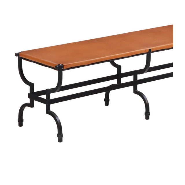 A sophisticated French bench featuring a hand-forged wrought iron frame with elegant neoclassical-inspired lines and a...