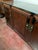 This vintage Chinese rosewood sideboard is a timeless statement piece that seamlessly blends authentic Chinoiserie style...