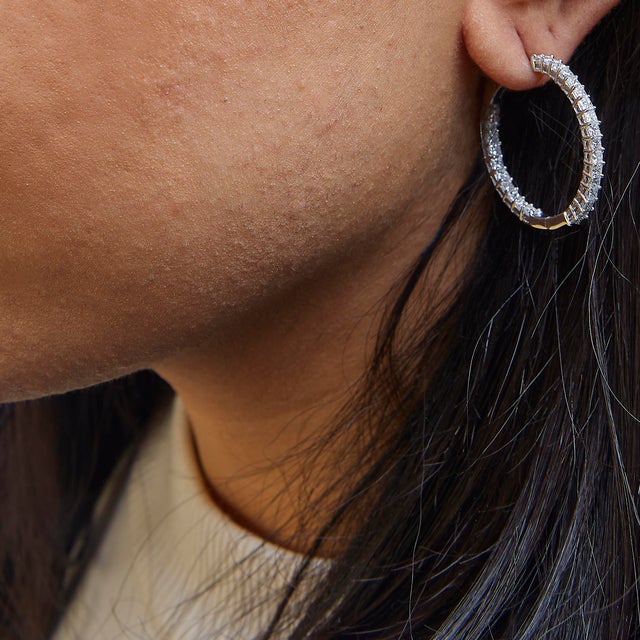 Discover the epitome of timeless elegance with these exquisite 14K white gold hoop earrings, adorned with a breathtaking...