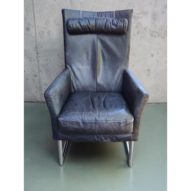 An original lounge chair by Montis—a renowned Dutch manufacturer of modern design. This model features an elegant, tall...
