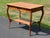 This antique Victorian oak side table is a charming piece of furniture that blends functionality with aesthetic appeal. It...