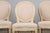 An exquisite set of six antique French dining chairs in the Louis XVI style, sourced from Provence, France. Each chair...