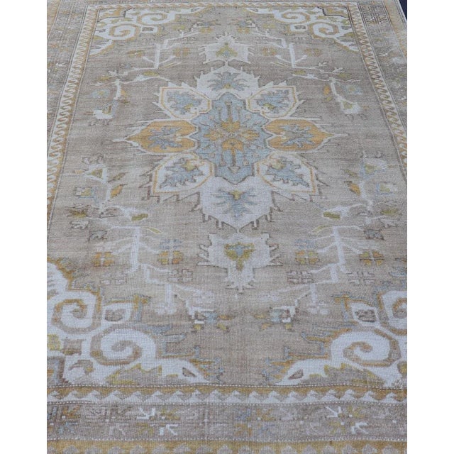 Measures: 6'7 x 9'6 Vintage Hand Knotted Turkish Oushak Kars in Earthy Tones and Yellow Colors. circa/1940 Keivan Woven...