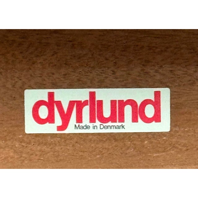 This is a 1970s Danish modern rosewood and teak coffee table by Drylund. Drylund was highly regarded for its beautiful use...