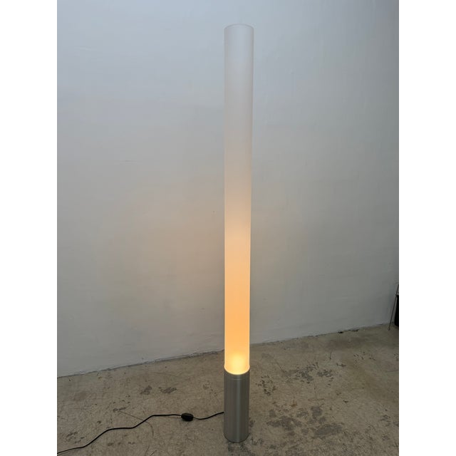 Tall tubular floor lamp designed by Pablo Pardo for Pablo. Its refined machined aluminum base combined with its towering...