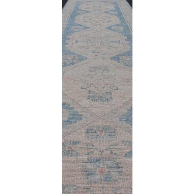 Measures: 2'10 x 12'6 Oushak Modern Runner with Medallion Design In Shades of Blue and Cream. Keivan Woven Arts; rug...