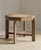 Vintage wooden side table, octagon shaped with four legs. This raw wood end table is from Belgium and was made in the...