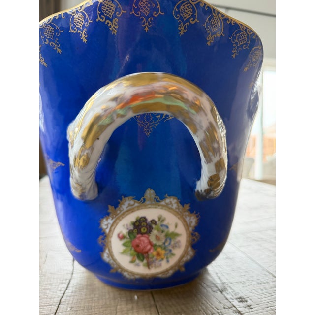 Monumental cobalt blue porcelain champagne cooler / centerpiece vessel with ornate gilt detailing, floral medallions,...