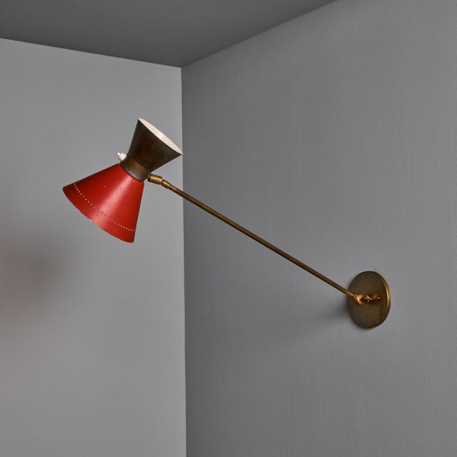 1960s Large Red and Grey Diabolo Articulating Wall Lamp Attributed to Pierre Guariche A rare and elegant example of...
