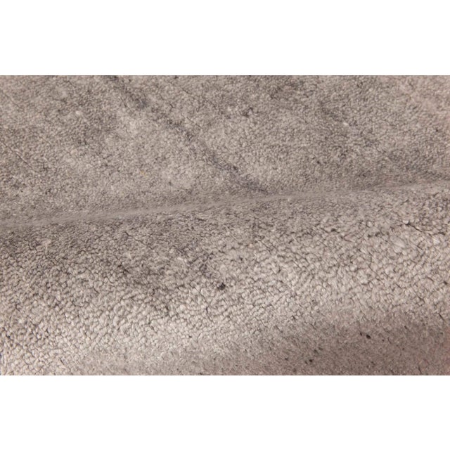 Contemporary silver handmade wool rug by Doris Leslie Blau Size: 7'6" × 13'2" (228 × 401 cm) What makes contemporary rugs...