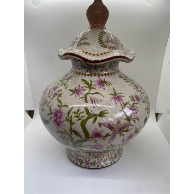 Transport yourself to an era of elegance with this exquisite vintage ginger jar. Crafted from delicate porcelain, its...