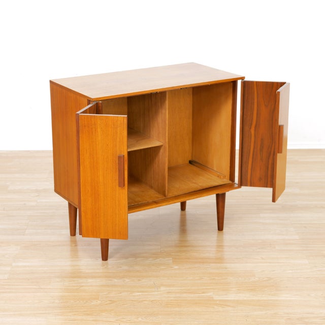 This mid-century vinyl record storage cabinet was made in the 1970s and is typical of the period. Produced in England this...