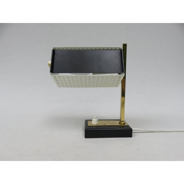 A pair of dainty table lamps, also suitable as bedside lamps, manufactured in Germany in the 1950s. The combination of...