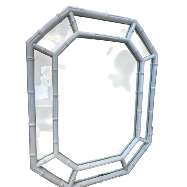 Vintage mid-century octagonal wall mirror featuring a chic white faux bamboo frame inspired by classic Palm Beach and...