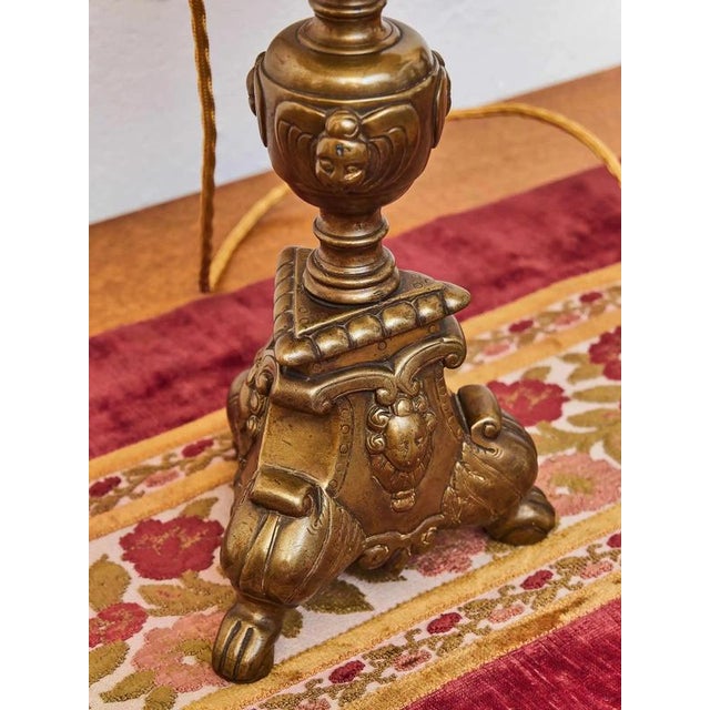 Lamp made from an original 18th century candlestick. High-quality and heavy candlestick cast from bell-shaped metal with...