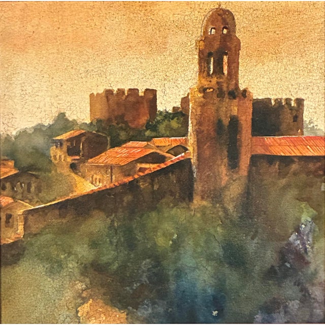 A beautifully framed Mediterranean village landscape from the Roma Moulding Wall Décor Collection, featuring a romantic...