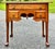 Lowboy style side table by Pennsylvania House. Crafted in solid cherry. Single full width top drawer with two small...