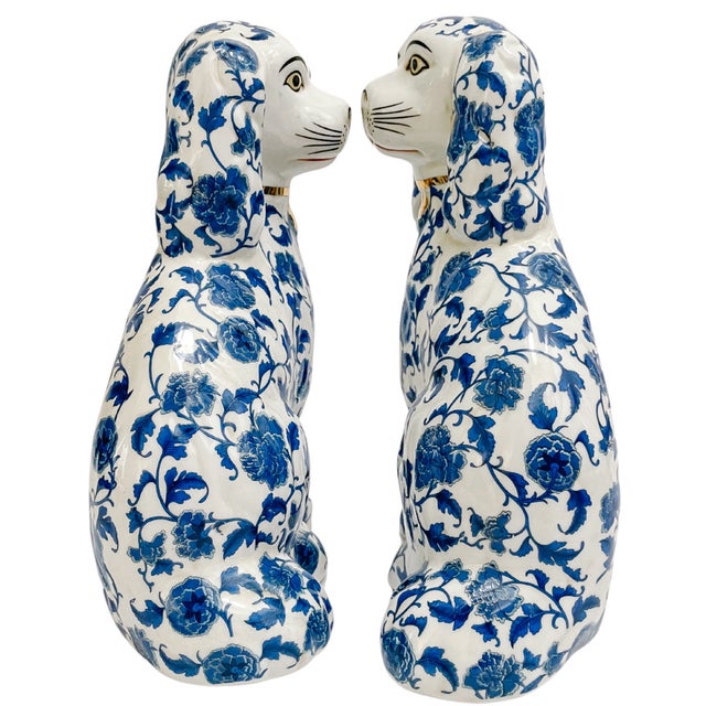 A beautiful pair of contemporary Staffordshire style Spaniel mantle dogs featuring a classic blue and white floral design...