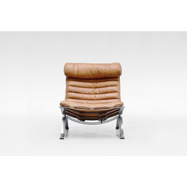 The Ari Chair by Arne Norell is a stunning example of Scandinavian Modern design, combining luxury with effortless...