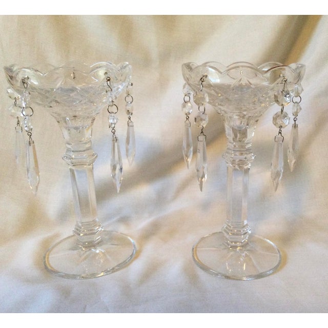 Set of two candle holders with five crystal prisms. Can be used with either pillar or stick candles. They have a pretty...