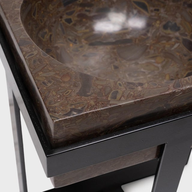 Ideal indoors or out, this clean-lined side table is comprised of a square puddingstone top elevated by a powder-coated...