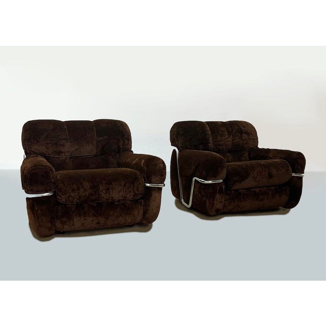 Particular pair of ernesto radaelli armchairs model 'wopps', 1970 composed of brown fabric with a structure supported by...