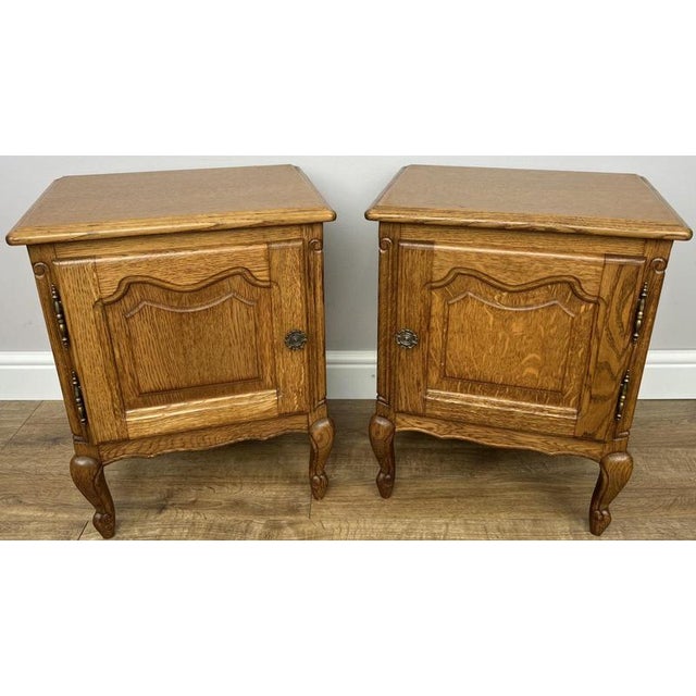 Bring timeless French charm to your home with this elegant pair of Vintage French Louis bedside tables. Featuring graceful...
