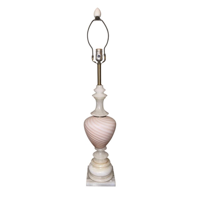Stunning pair of Mid-20th Century Italian table lamps featuring light pink and white swirl Murano glass bodies paired with...
