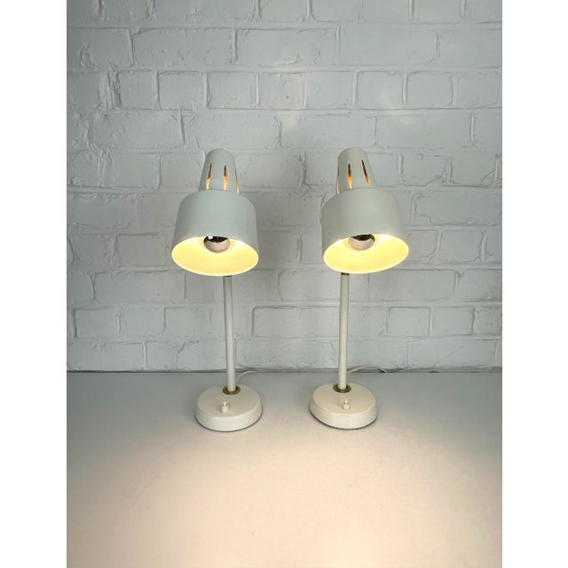 This elegant pair of desk lamps was manufactured by bäcklunds järn & smide (bjs) in skellefteå, sweden during the 1960s....
